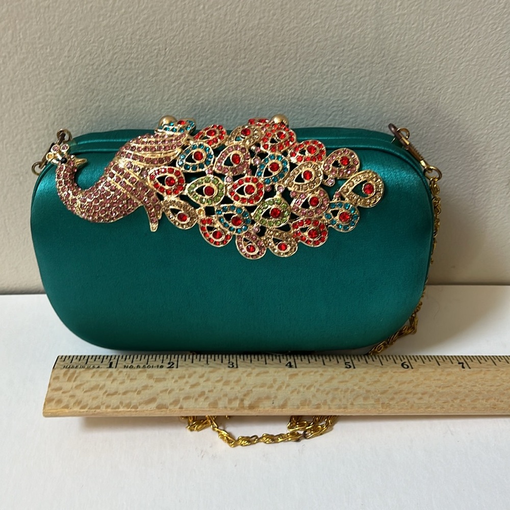 Jn’s  Evening bag with peacock embellishment.